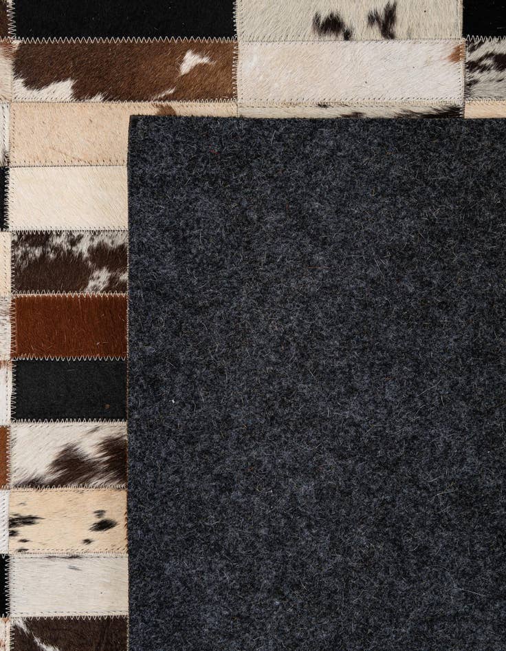 Detail image of  5' 2 x 7' 11 Cowhide - Patchwork Rug