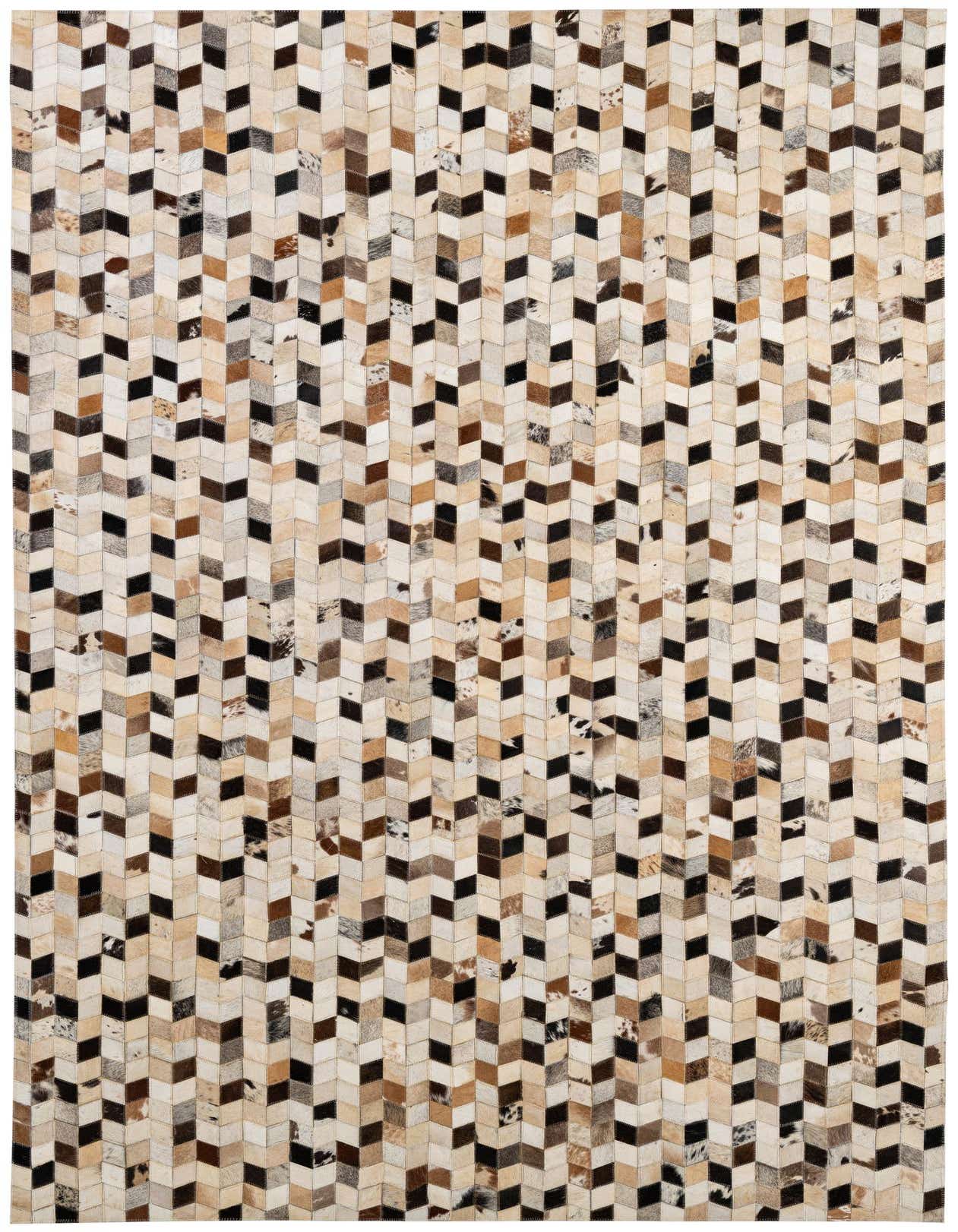 A 5x8 rectangular Cowhide Patchwork rug featuring a modern chevron pattern in multi-colored natural cowhide and leather.