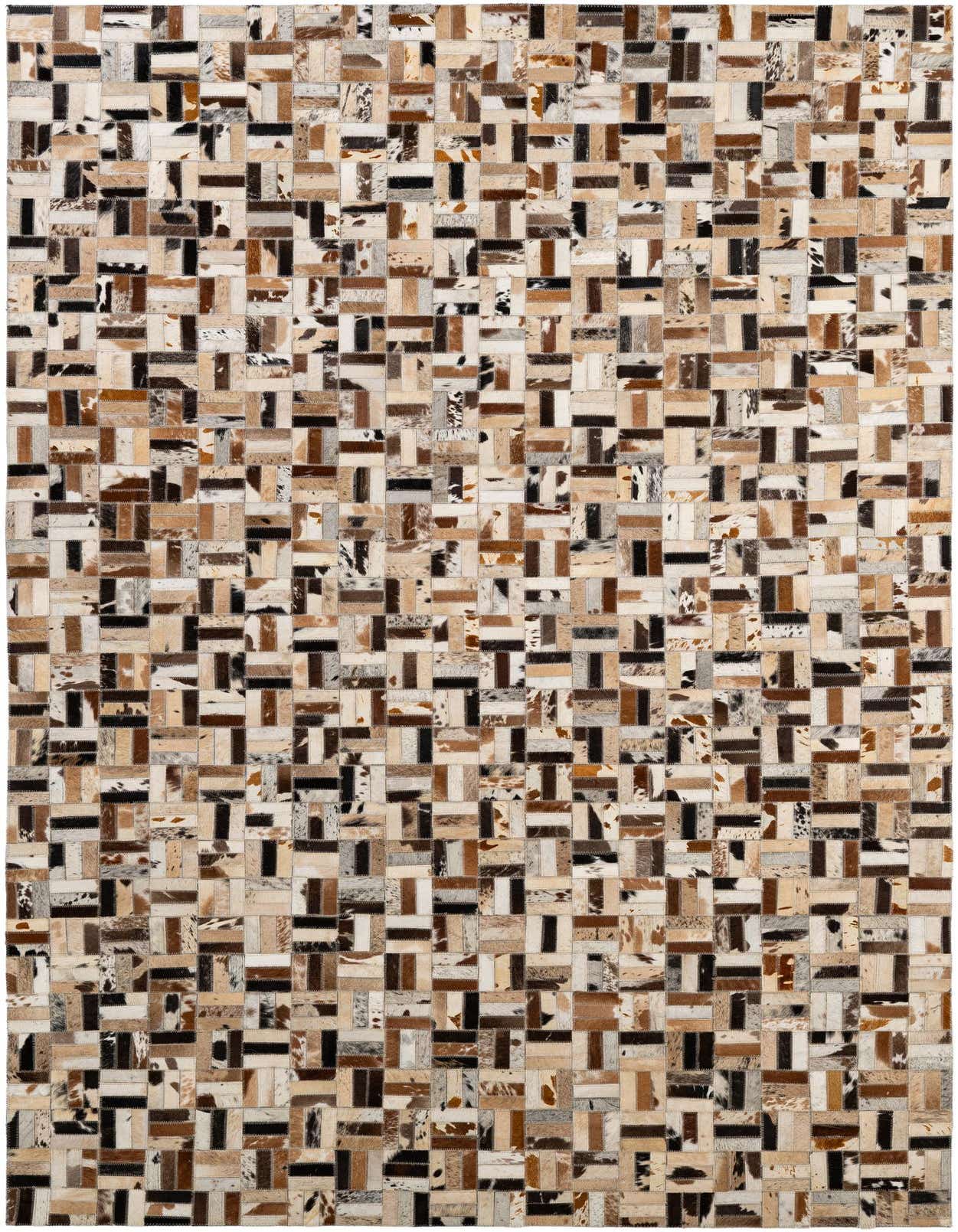 A 5x8 rectangular patchwork cowhide rug with varied natural shades of brown, black, white, and tan, suitable for a modern living room.