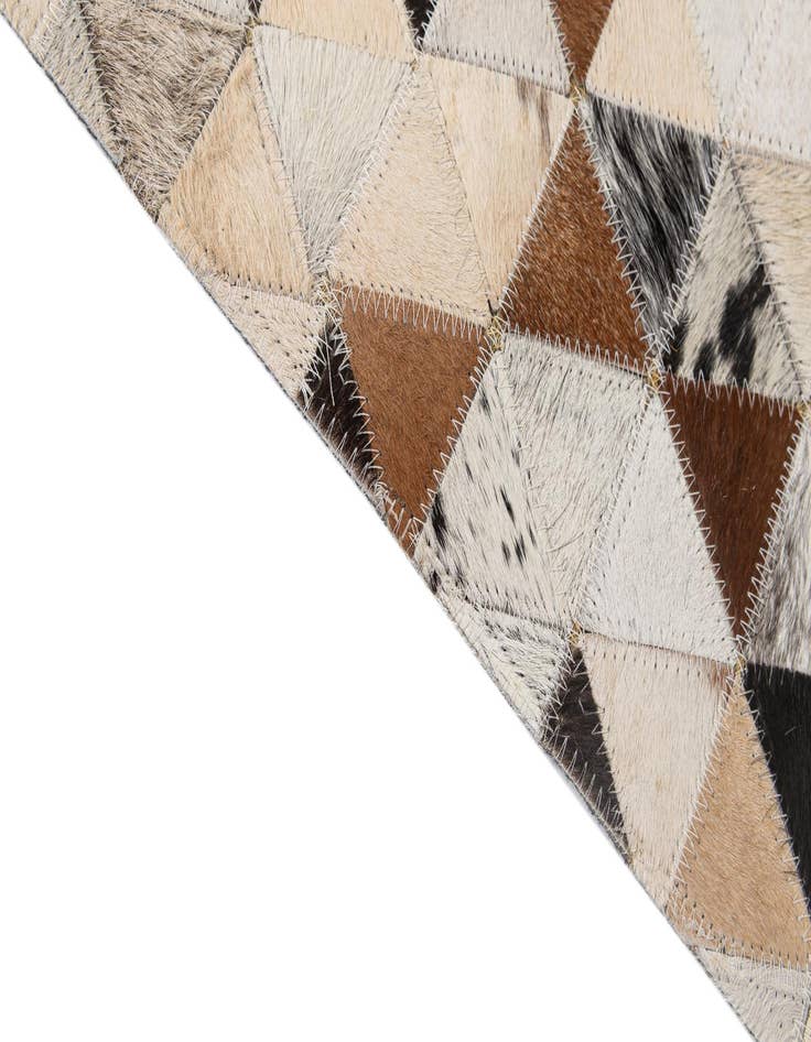 Detail image of  5' 1 x 7' 11 Cowhide - Patchwork Rug
