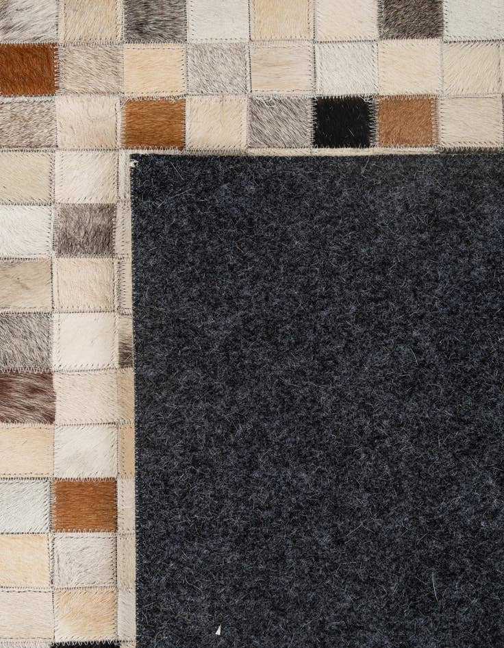 Detail image of  5' 1 x 7' 11 Cowhide - Patchwork Rug