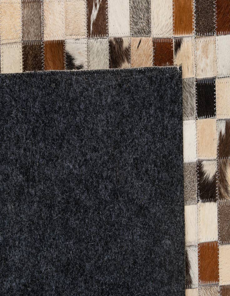 Detail image of  5' 1 x 7' 10 Cowhide - Patchwork Rug