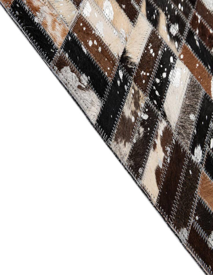 Detail image of  4' 11 x 7' 10 Cowhide - Patchwork Rug