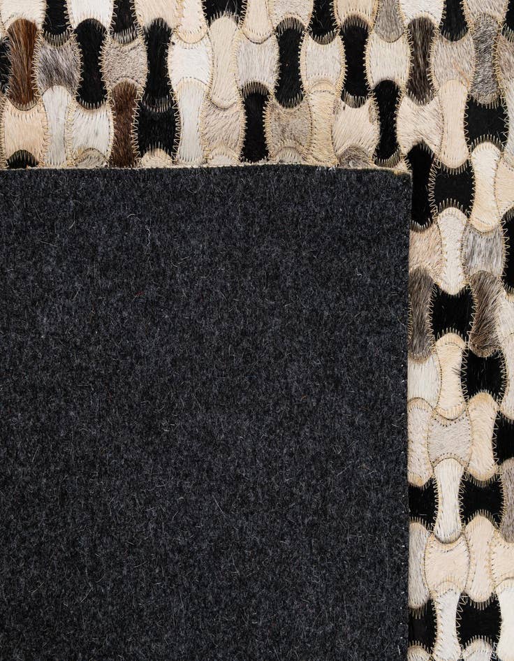 Detail image of  5' 1 x 8' 1 Cowhide - Patchwork Rug