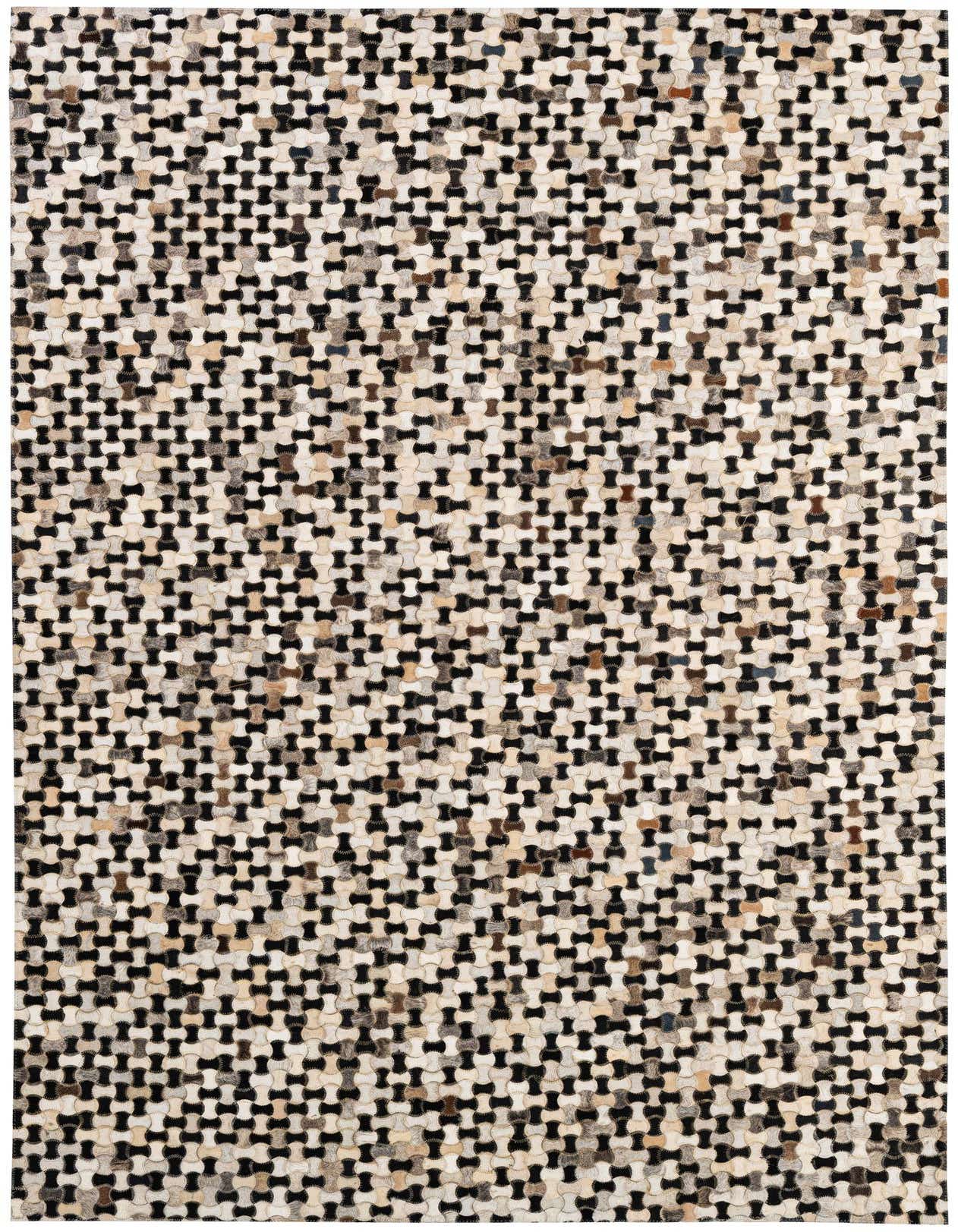 A 5x8 rectangular Cowhide Patchwork rug featuring a modern, multi-colored pattern of interlocking shapes in black, white, and various natural hide tones.