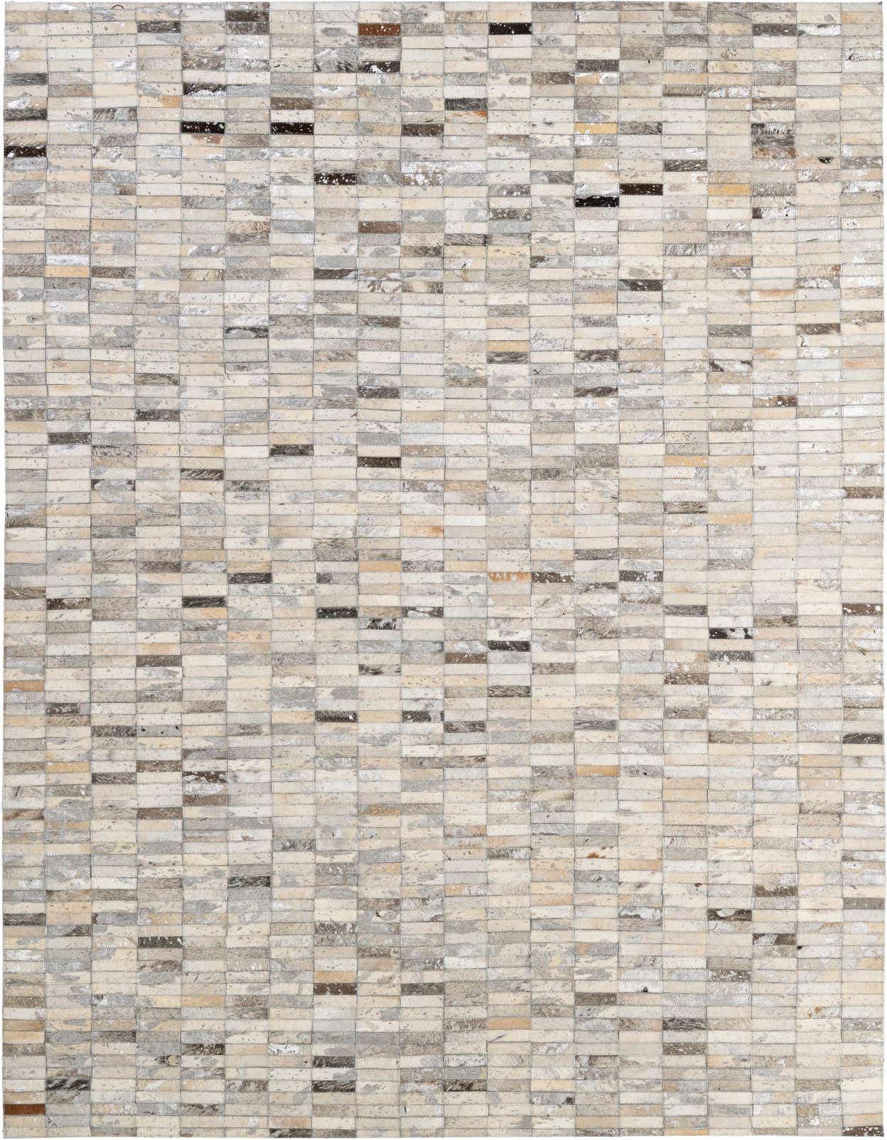 A rectangular 5x8 modern patchwork rug made from multi-colored cowhide and leather, featuring various shades of beige, brown, and gray.