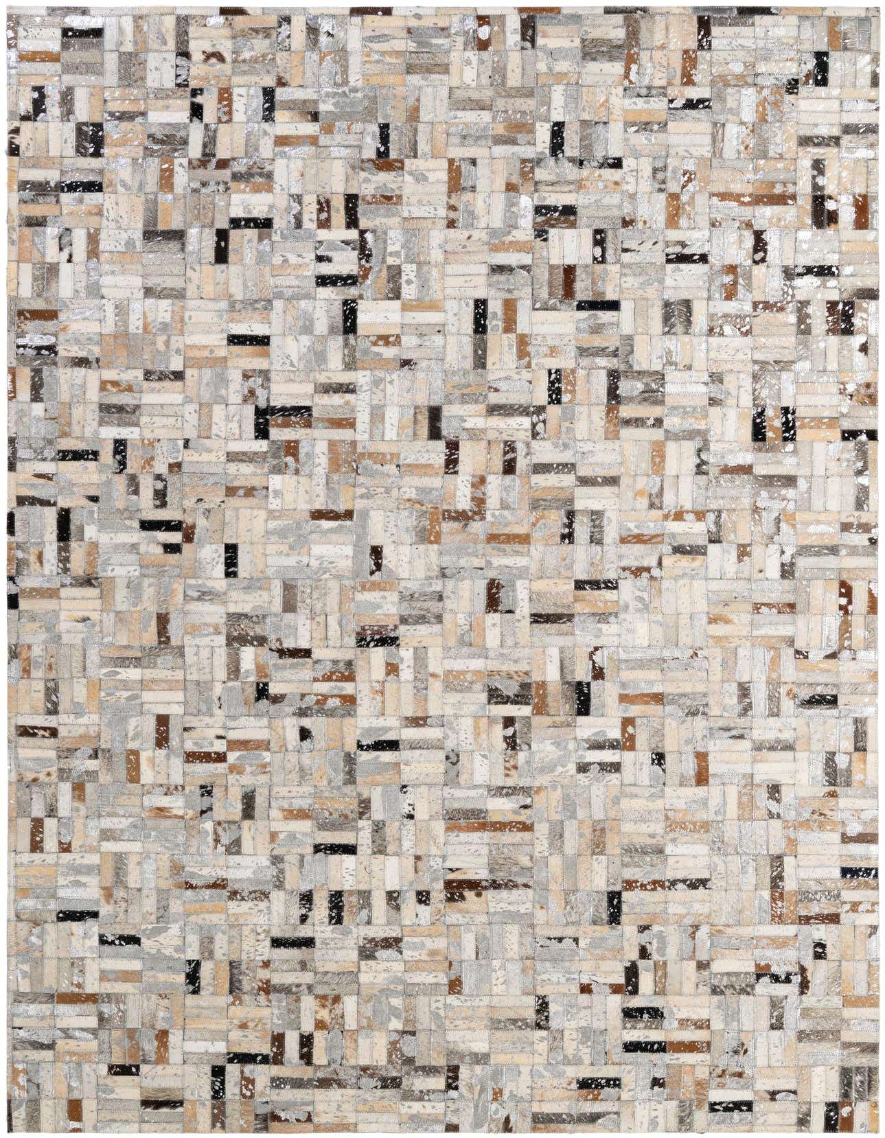 A rectangular 5x8 modern patchwork cowhide rug with multi-colored natural tones of brown, black, white, and grey.