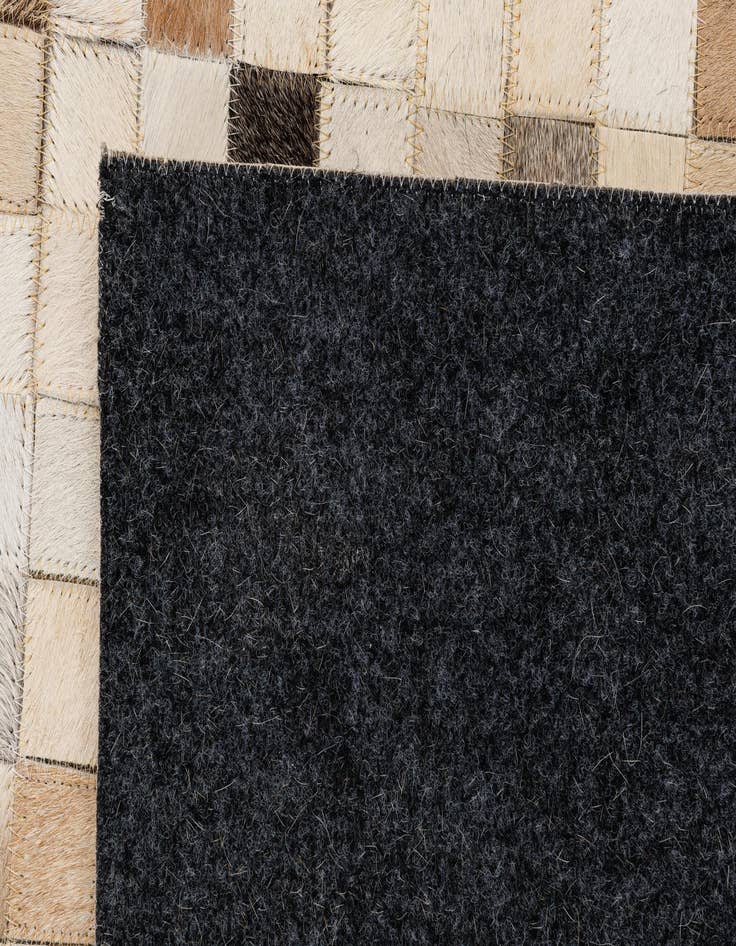 Detail image of  5' 2 x 7' 11 Cowhide - Patchwork Rug