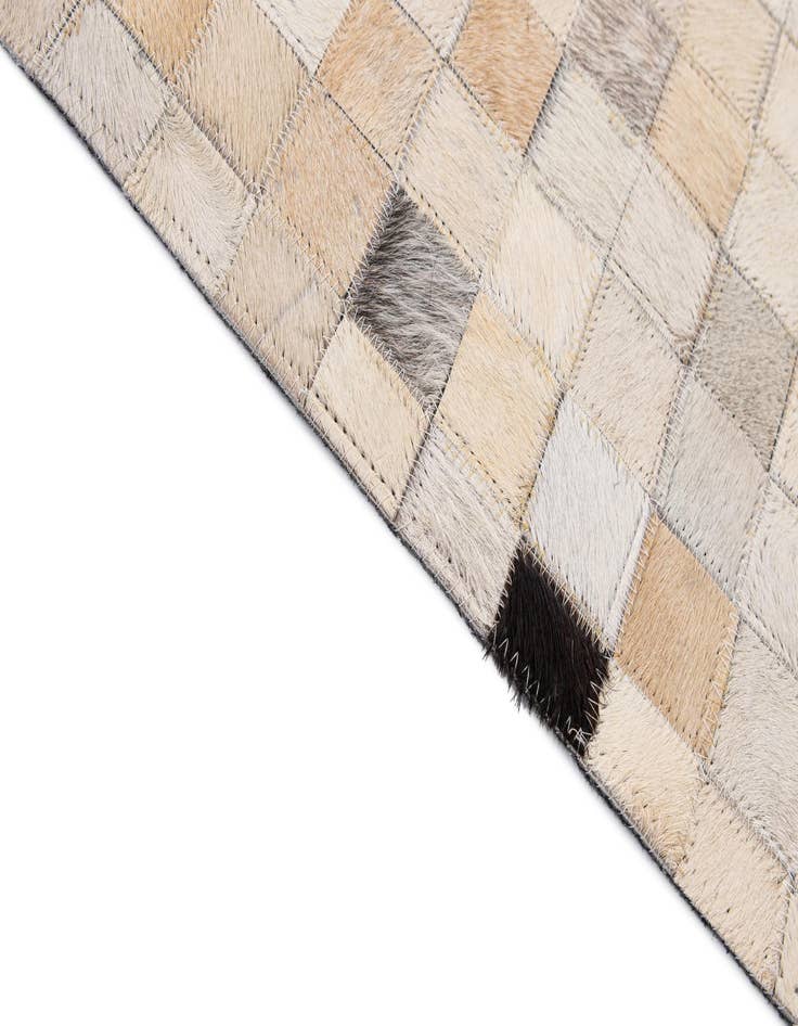 Detail image of  5' 1 x 7' 11 Cowhide - Patchwork Rug