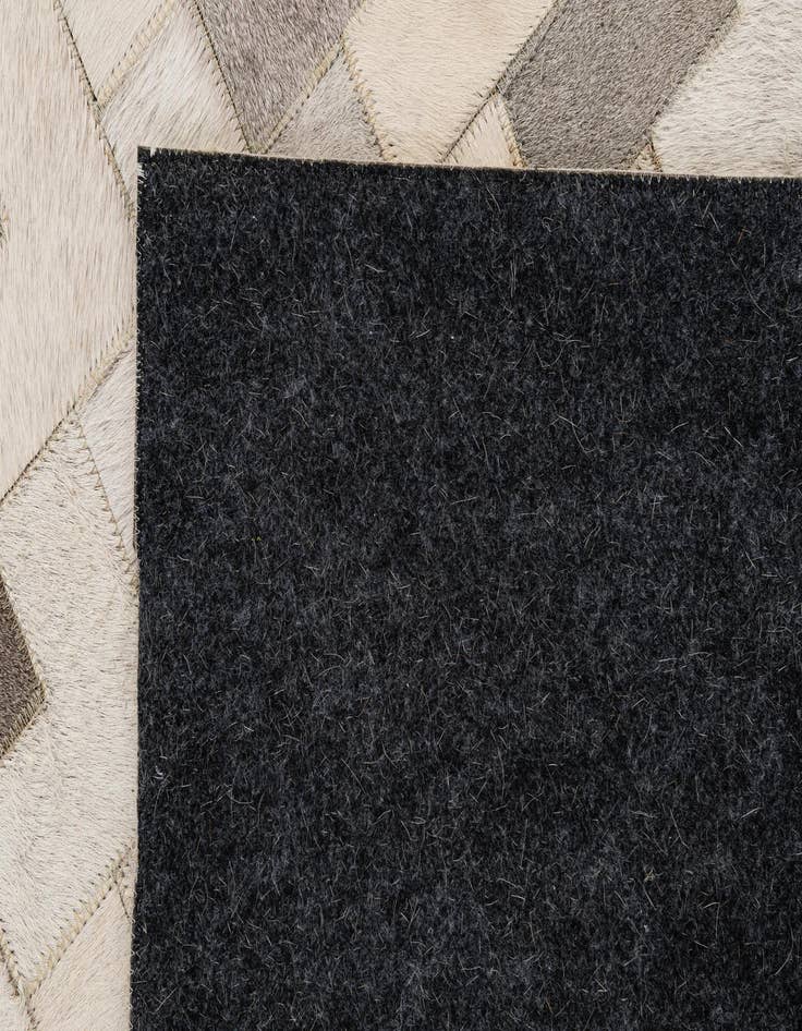 Detail image of  5' 2 x 8' Cowhide - Patchwork Rug