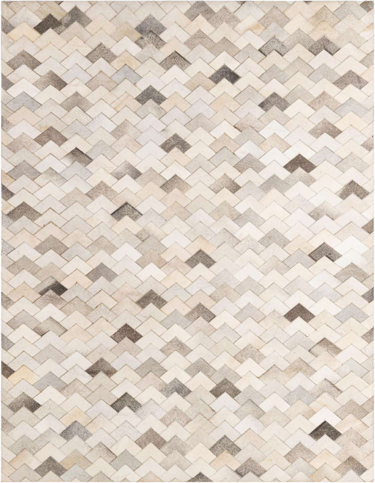 A 5x8 rectangular Cowhide Patchwork rug featuring a modern chevron pattern in various shades of multi-colored natural cowhide.
