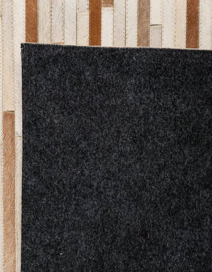 Detail image of  5' 1 x 7' 11 Cowhide - Patchwork Rug