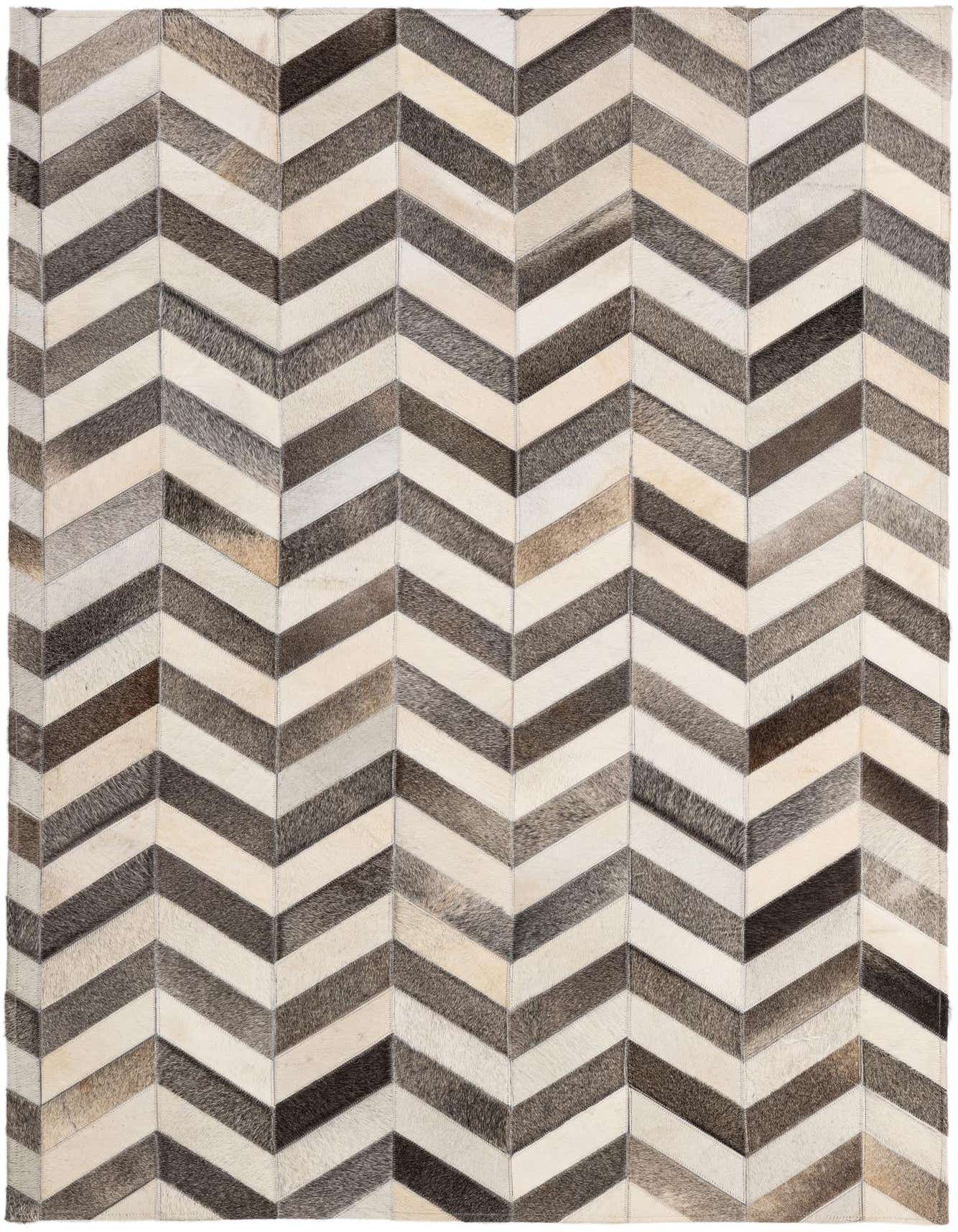 A rectangular 4x6 modern cowhide rug with a multi-colored chevron pattern in shades of brown, grey, and white.
