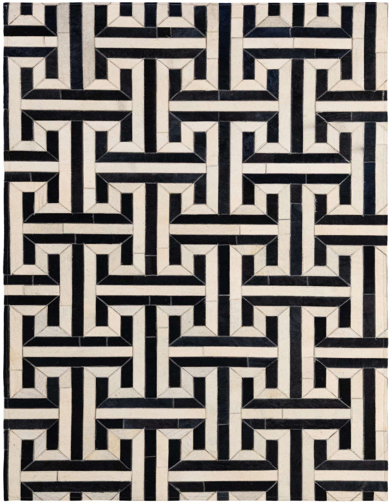 A rectangular 4x6 modern cowhide patchwork rug in a bold black and white geometric pattern, suitable for various indoor rooms.