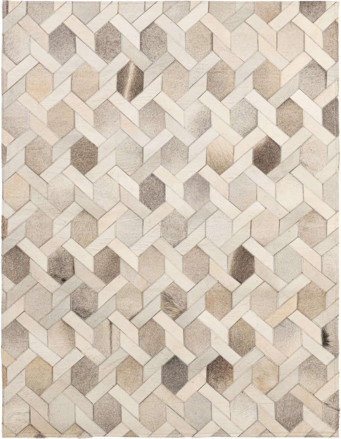 A 4x6 rectangular patchwork cowhide rug with a modern geometric pattern in various shades of beige, grey, and brown.