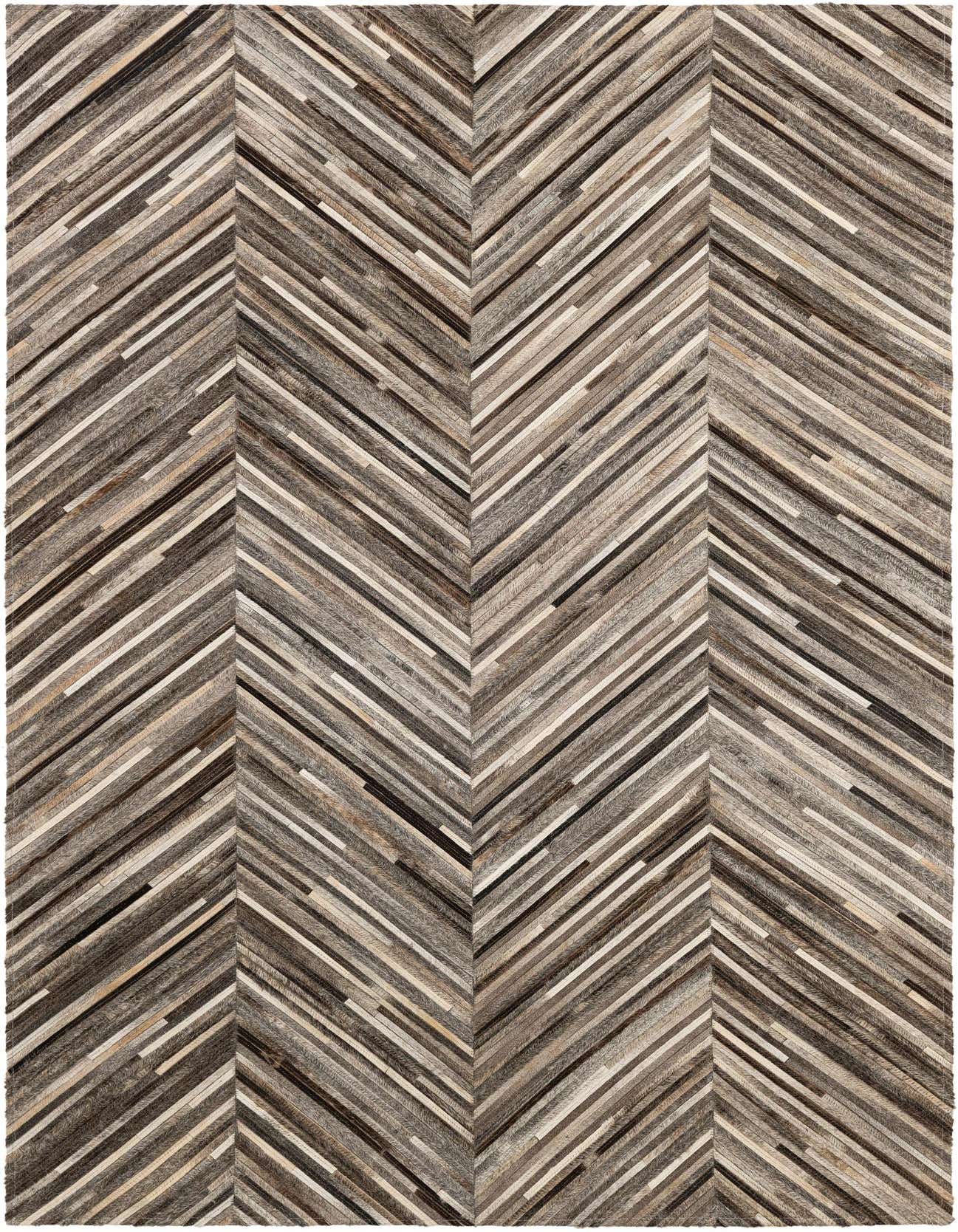A rectangular 4x6 modern cowhide rug featuring a multi-colored chevron pattern in various shades of brown, grey, and cream.