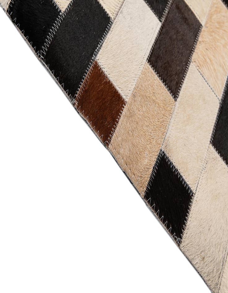 Detail image of  4' 1 x 5' 11 Cowhide - Patchwork Rug