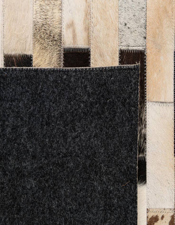 Detail image of  4' 1 x 5' 11 Cowhide - Patchwork Rug