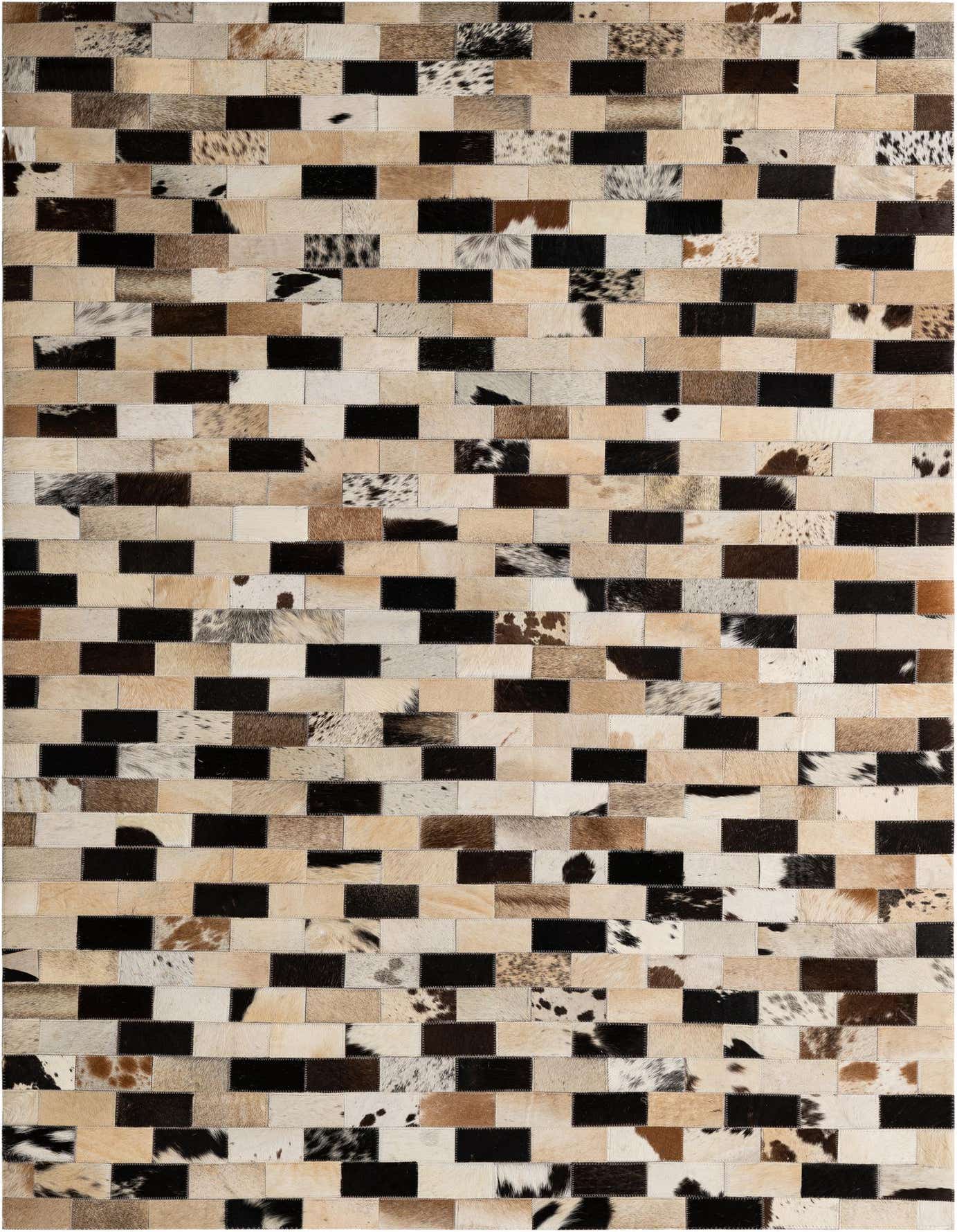 A 4x6 rectangular patchwork cowhide rug featuring a modern pattern of multi-colored natural hide squares in black, white, and various brown tones.