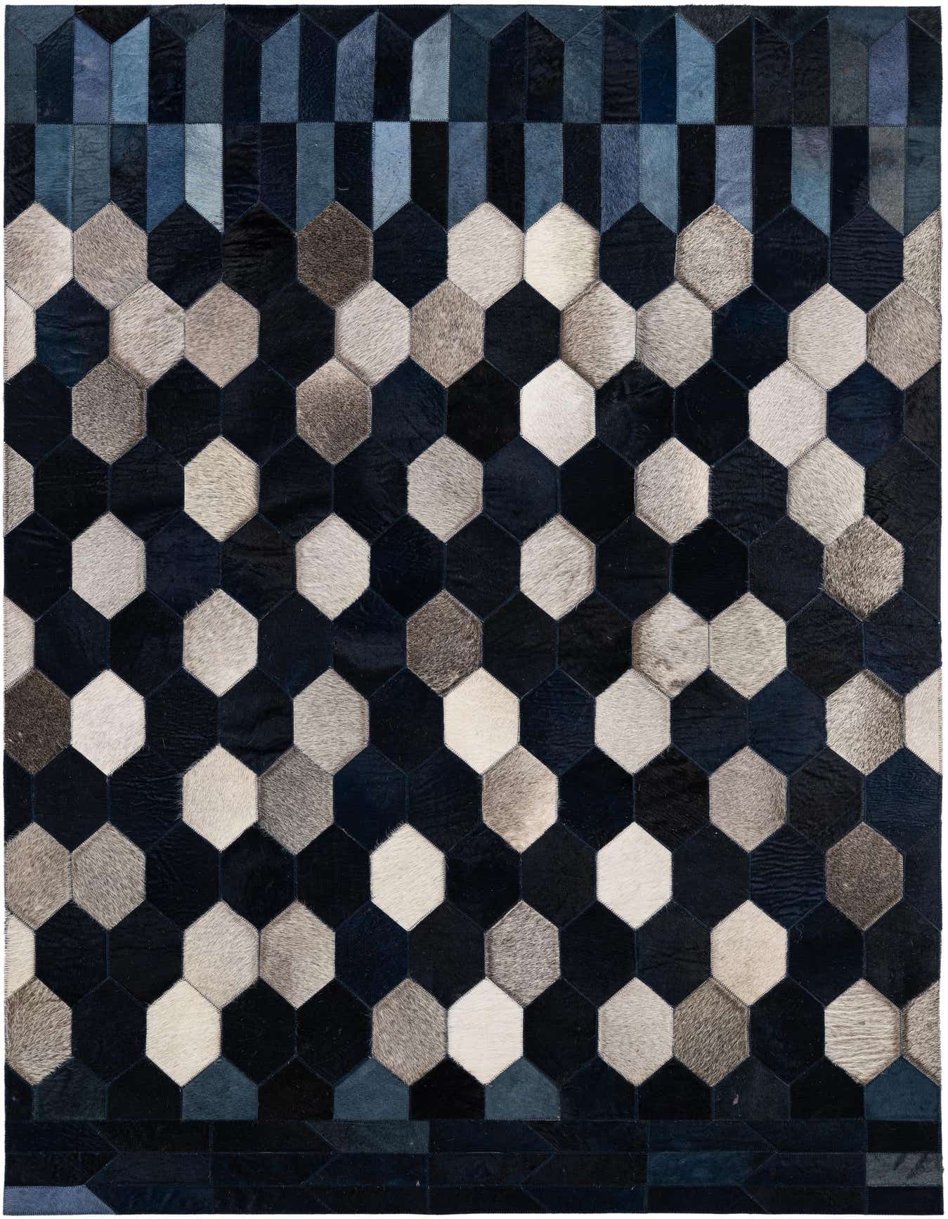 A 4x6 rectangular patchwork cowhide rug with a modern geometric pattern in various shades of blue, grey, and white.