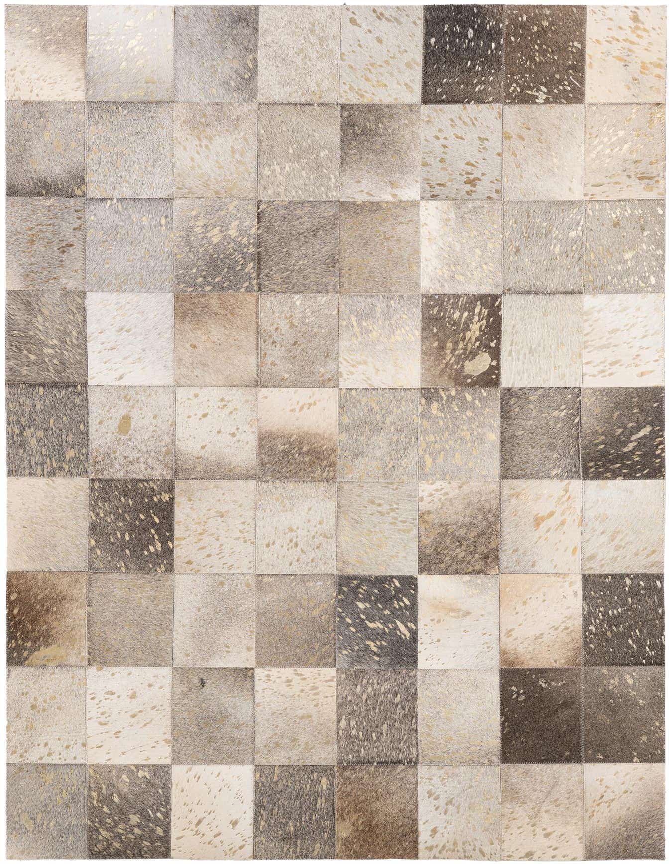 A 4x6 rectangular patchwork cowhide rug with multi-colored squares, some featuring gold metallic speckles, suitable for a modern living room.
