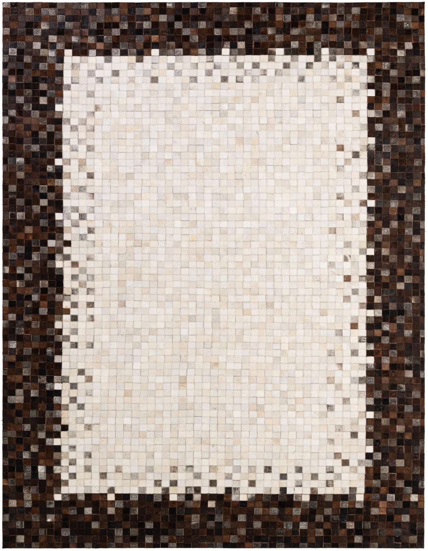 A rectangular 7x10 cowhide patchwork rug featuring a light center fading into a dark brown border.