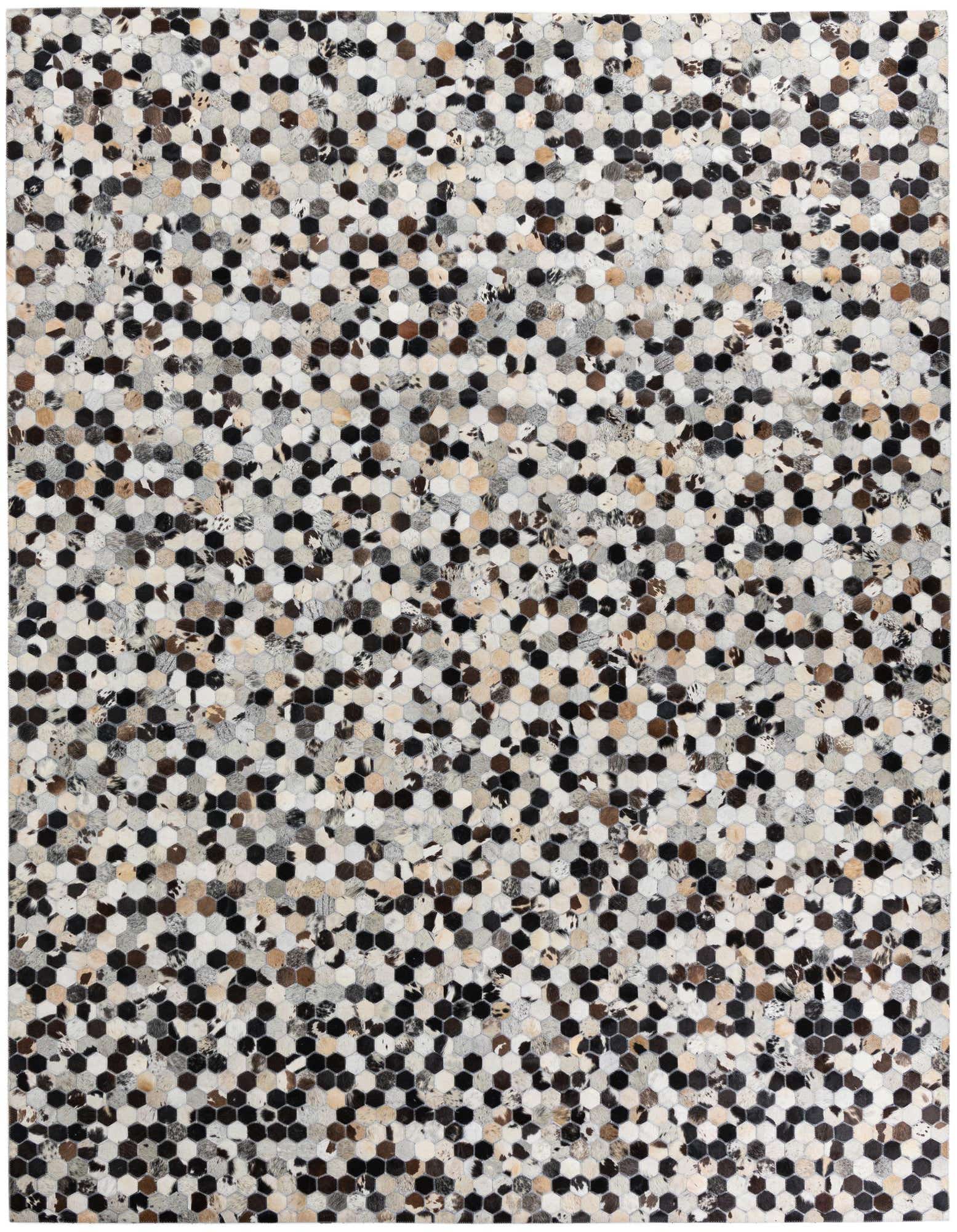A rectangular 8x10 multi-colored cowhide rug featuring a modern abstract pattern of small hexagonal patches in varying shades of black, white, brown, and grey.