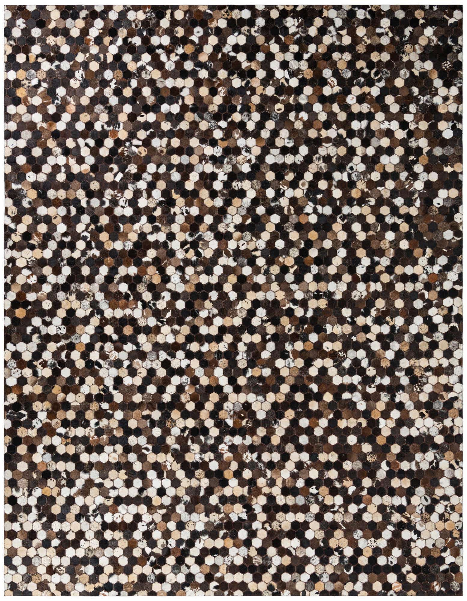 A rectangular 8x10 multi-colored modern rug made from cowhide and leather, featuring a mosaic of small hexagonal patches in shades of brown, black, and white.