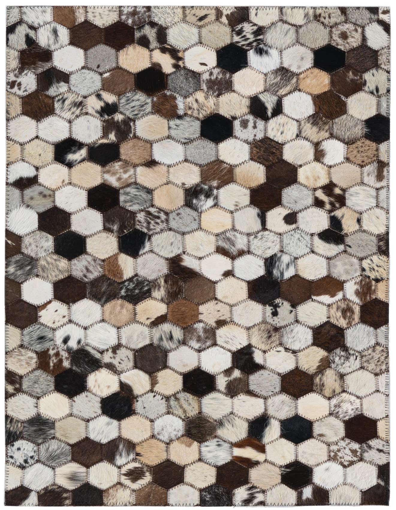 A 2x3 rectangular Rugs.com Cowhide Leather rug featuring a modern hexagonal patchwork design in multi-colored natural cowhide.