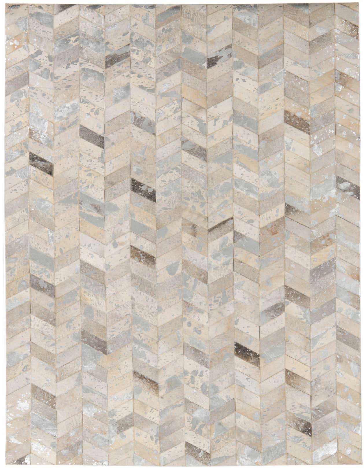 A 5x8 rectangular Cowhide Leather rug featuring a modern chevron pattern in multi-colored natural tones.