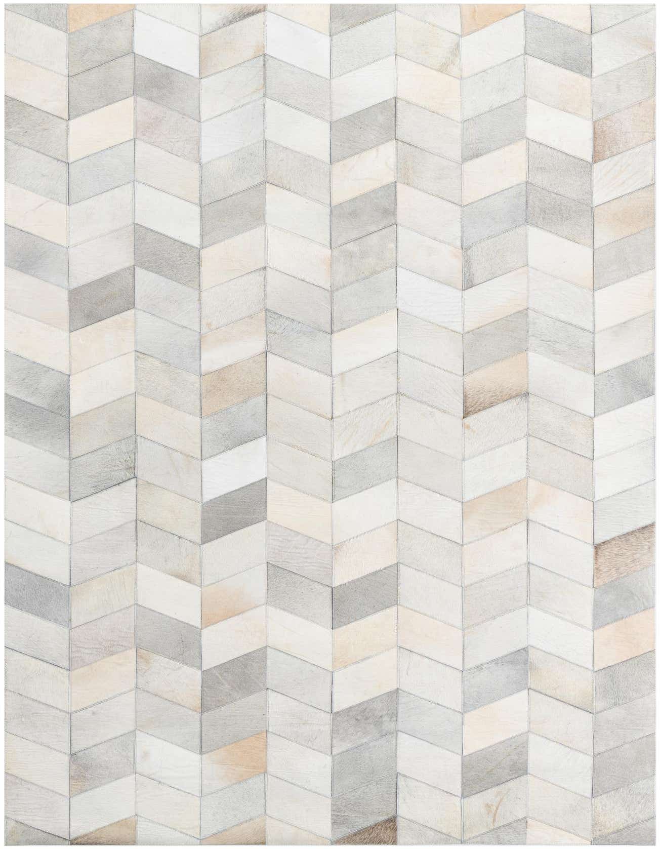 A 5x8 rectangular Cowhide Leather rug featuring a modern chevron pattern in various shades of gray, white, and beige.