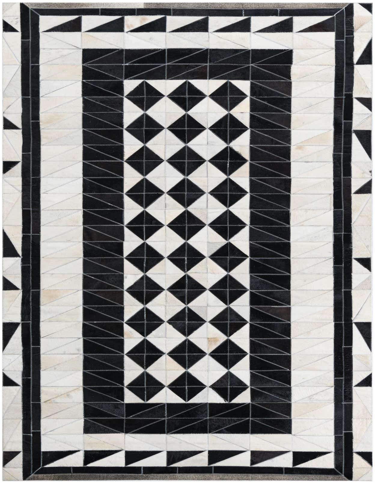 A 5x8 rectangular black and white cowhide rug with a modern geometric pattern, featuring a central diamond checkerboard.