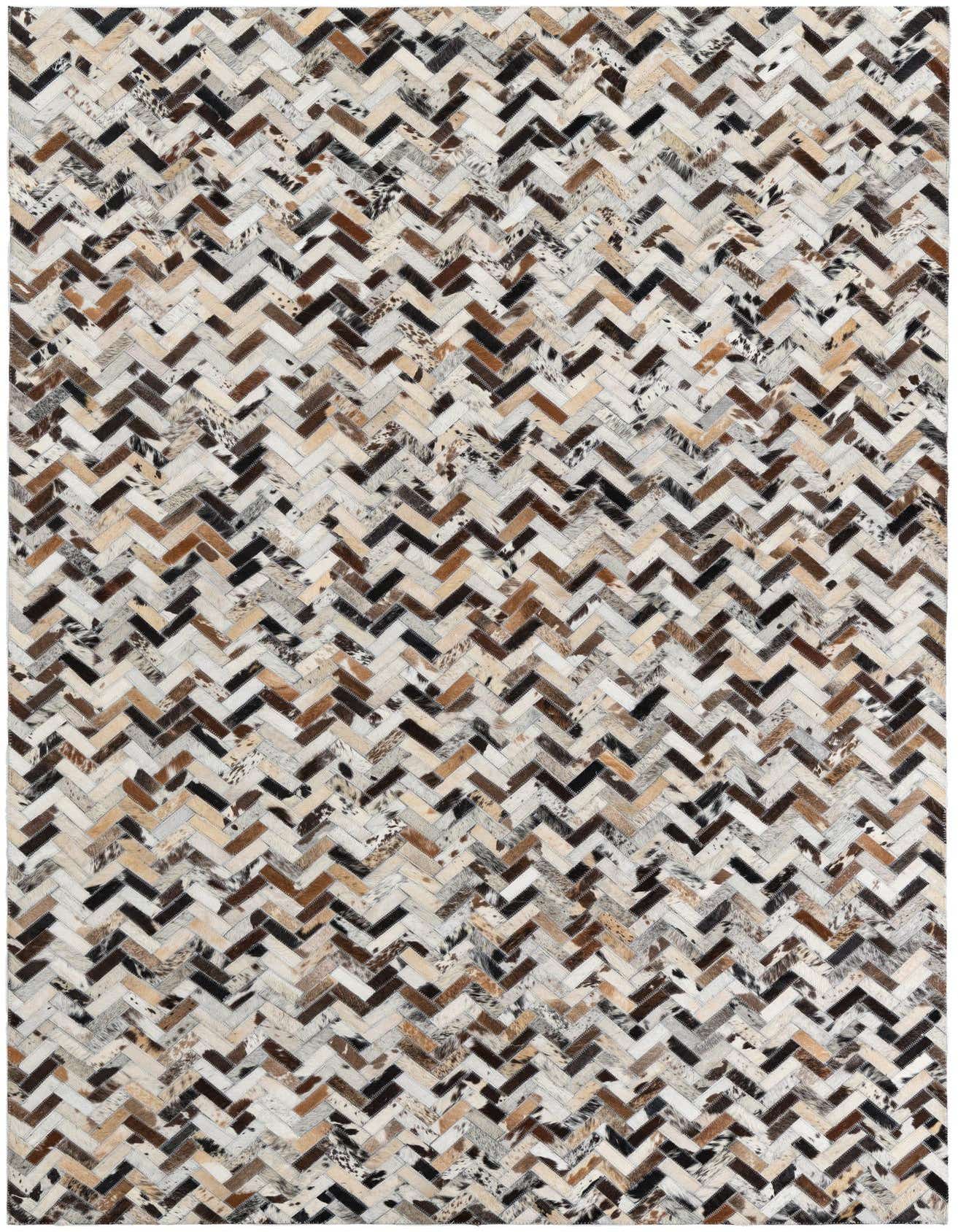 A rectangular 5x8 multi-colored cowhide and leather rug with a modern chevron pattern, ideal for a living room.