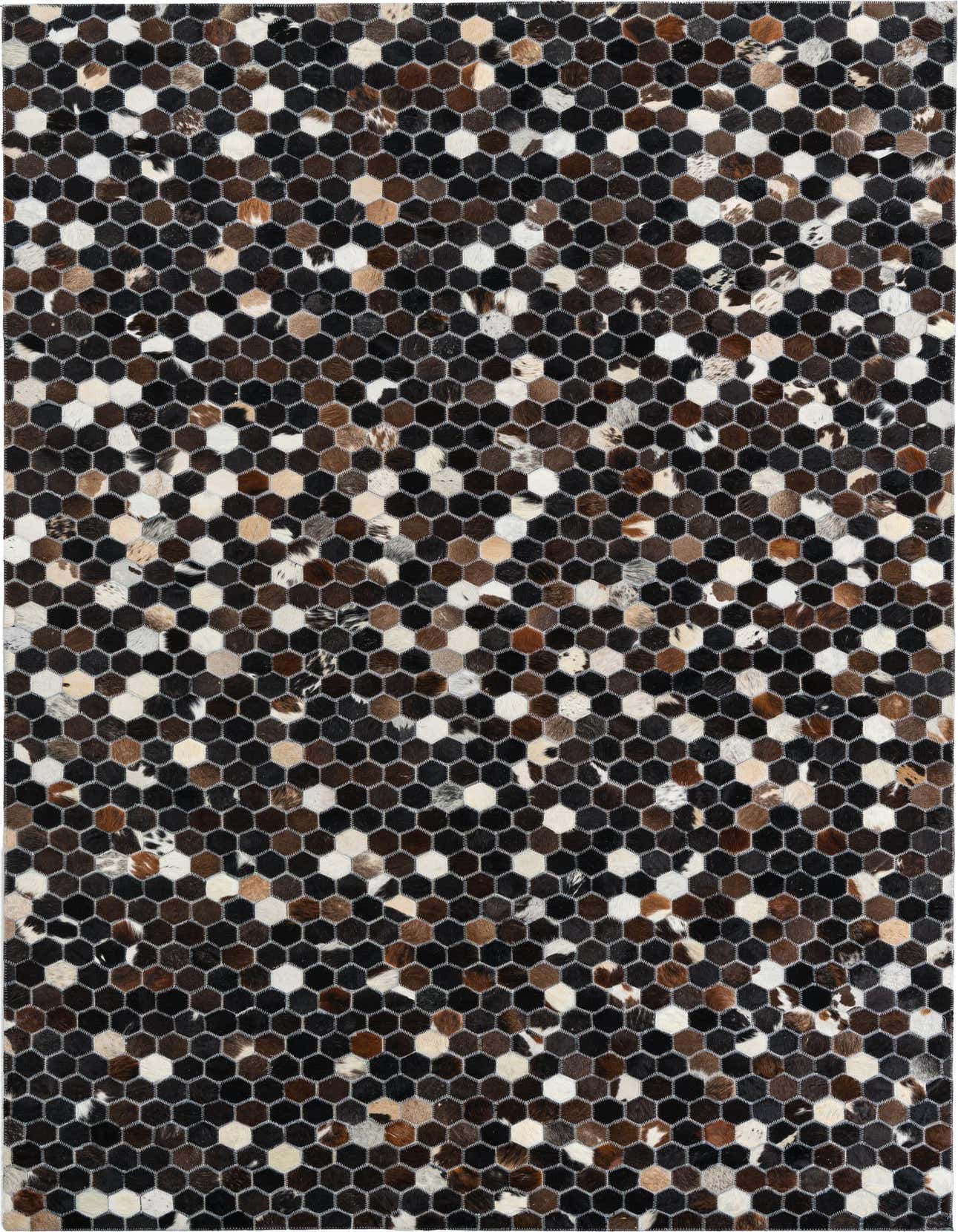 A rectangular 5x8 modern rug made of multi-colored cowhide and leather hexagons, perfect for a living room.
