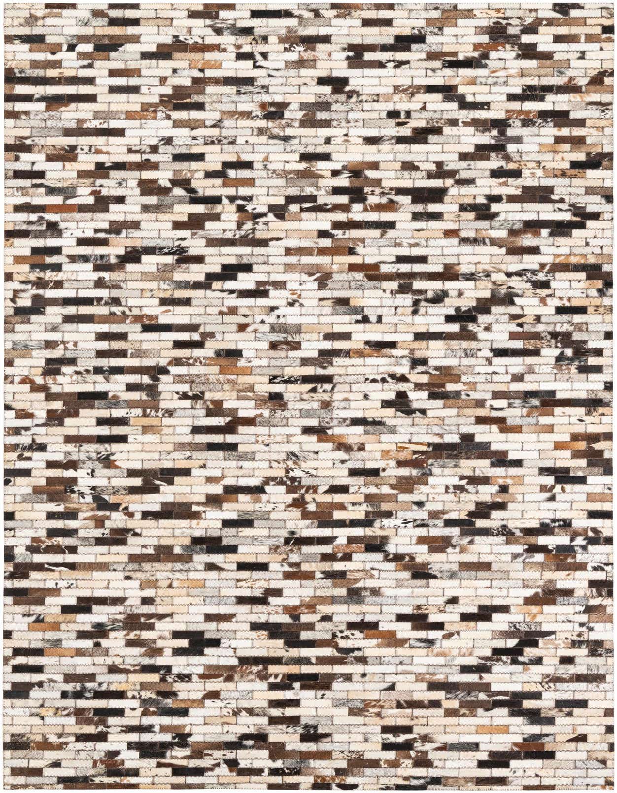 A rectangular 5x8 modern area rug made from multi-colored cowhide and leather patches in a brick-like pattern.