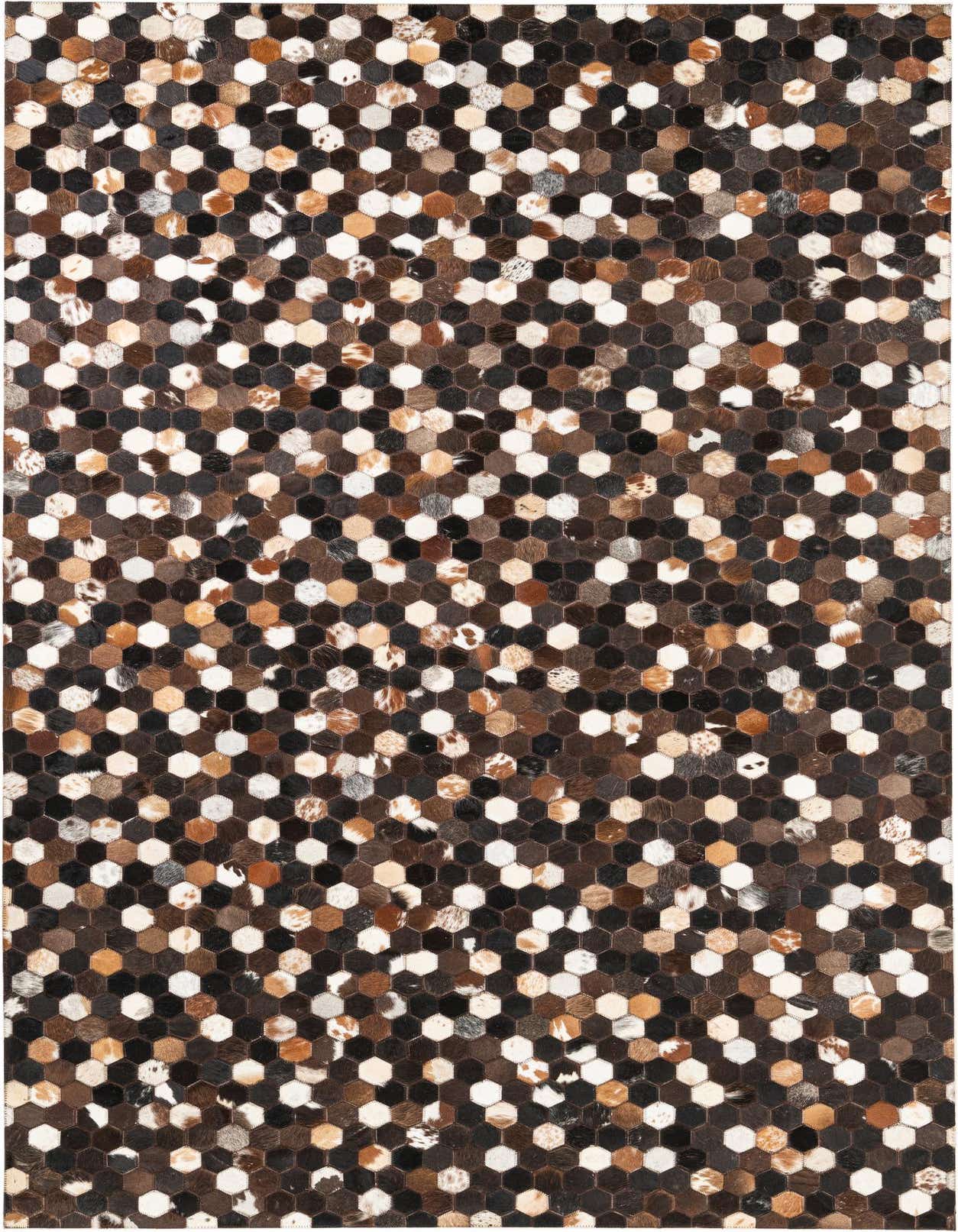 A 5x8 rectangular rug featuring a modern, abstract pattern of multi-colored cowhide and leather hexagons in shades of brown, black, white, and tan.