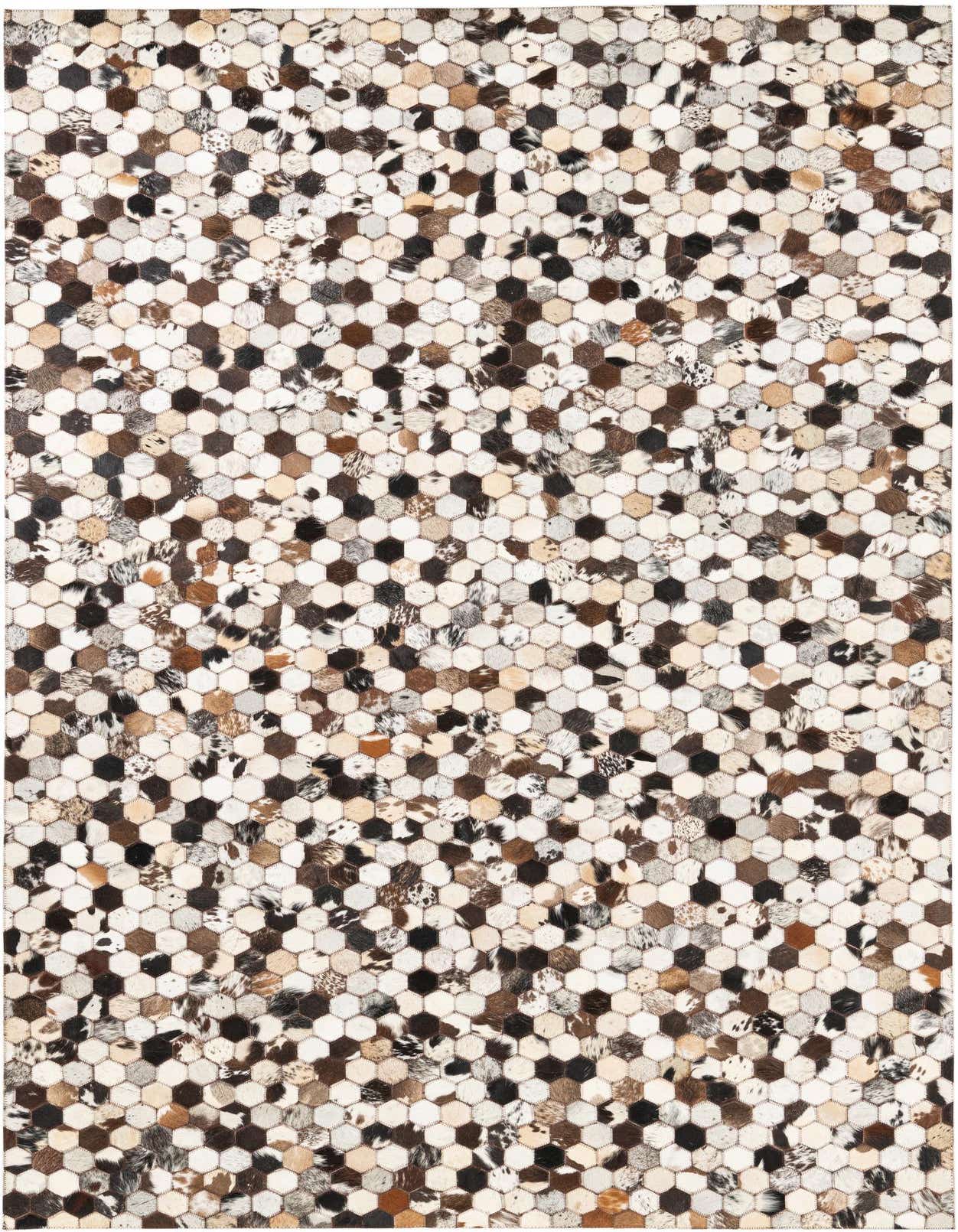 A rectangular 5x8 multi-colored cowhide rug with a modern hexagonal patchwork pattern, ideal for a living room.