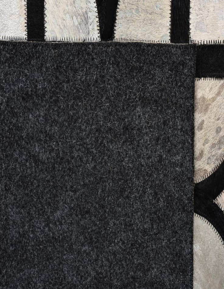 Detail image of  5' 3 x 7' 8 Cowhide Rug