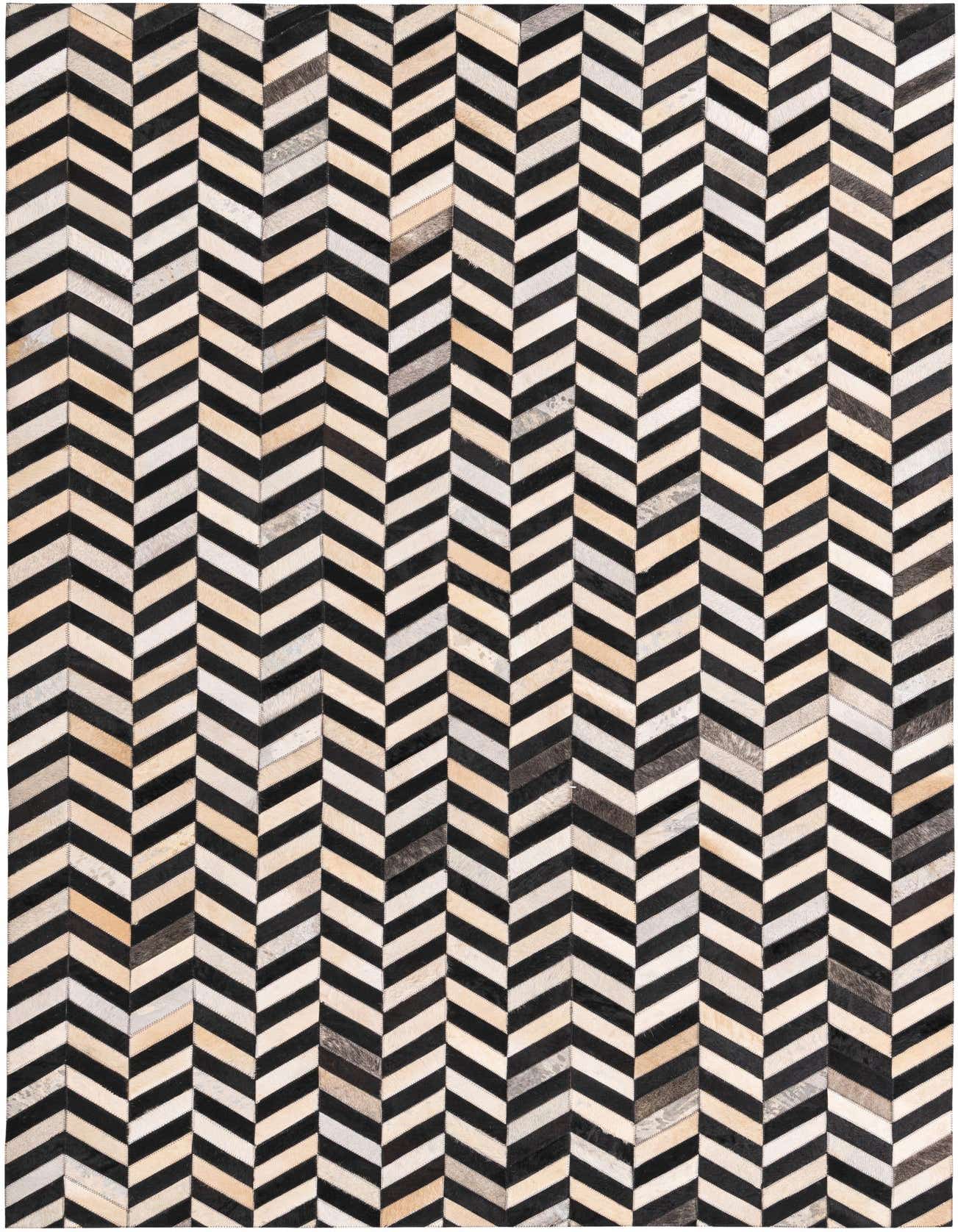 A 5x8 rectangular Cowhide rug with a modern chevron pattern in black, white, and various natural multi-colored cowhide patches.