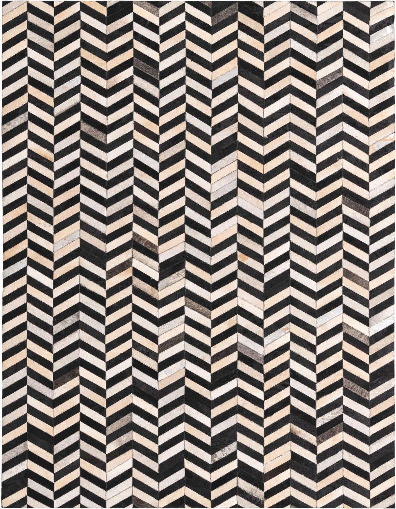 A 5x8 rectangular Cowhide rug with a modern chevron stripe pattern in black, white, and natural hide tones.