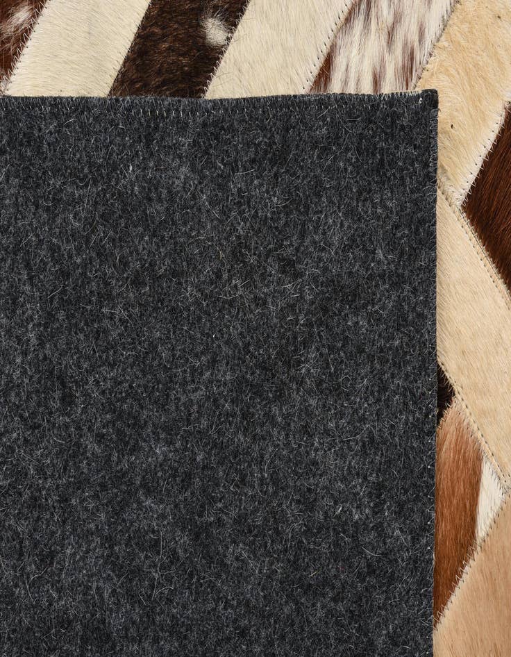 Detail image of  5' 4 x 7' 6 Cowhide Rug