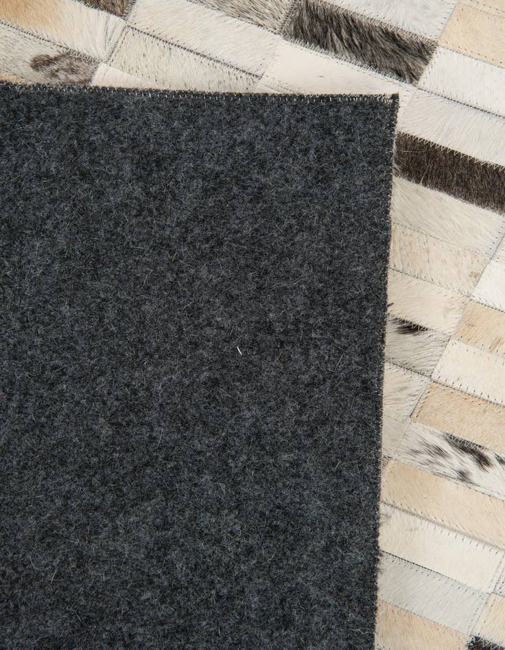 Detail image of  7' 11 x 9' 9 Cowhide Stocks Rug