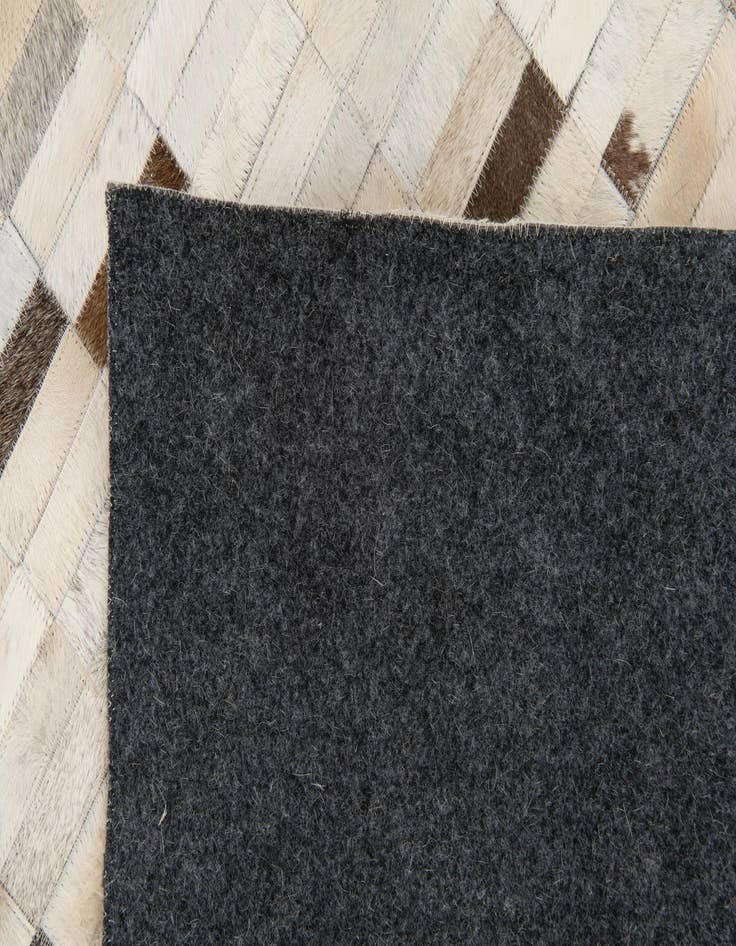 Detail image of  7' 11 x 9' 9 Cowhide Stocks Rug