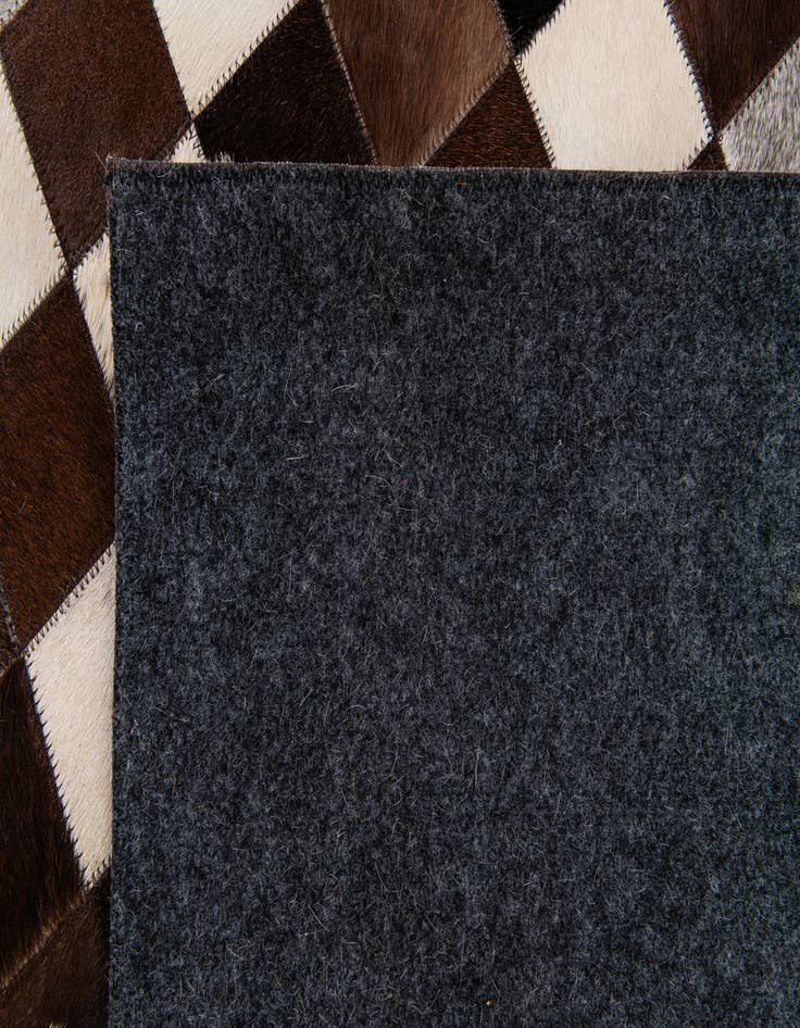 Detail image of  7' 11 x 9' 10 Cowhide Stocks Rug