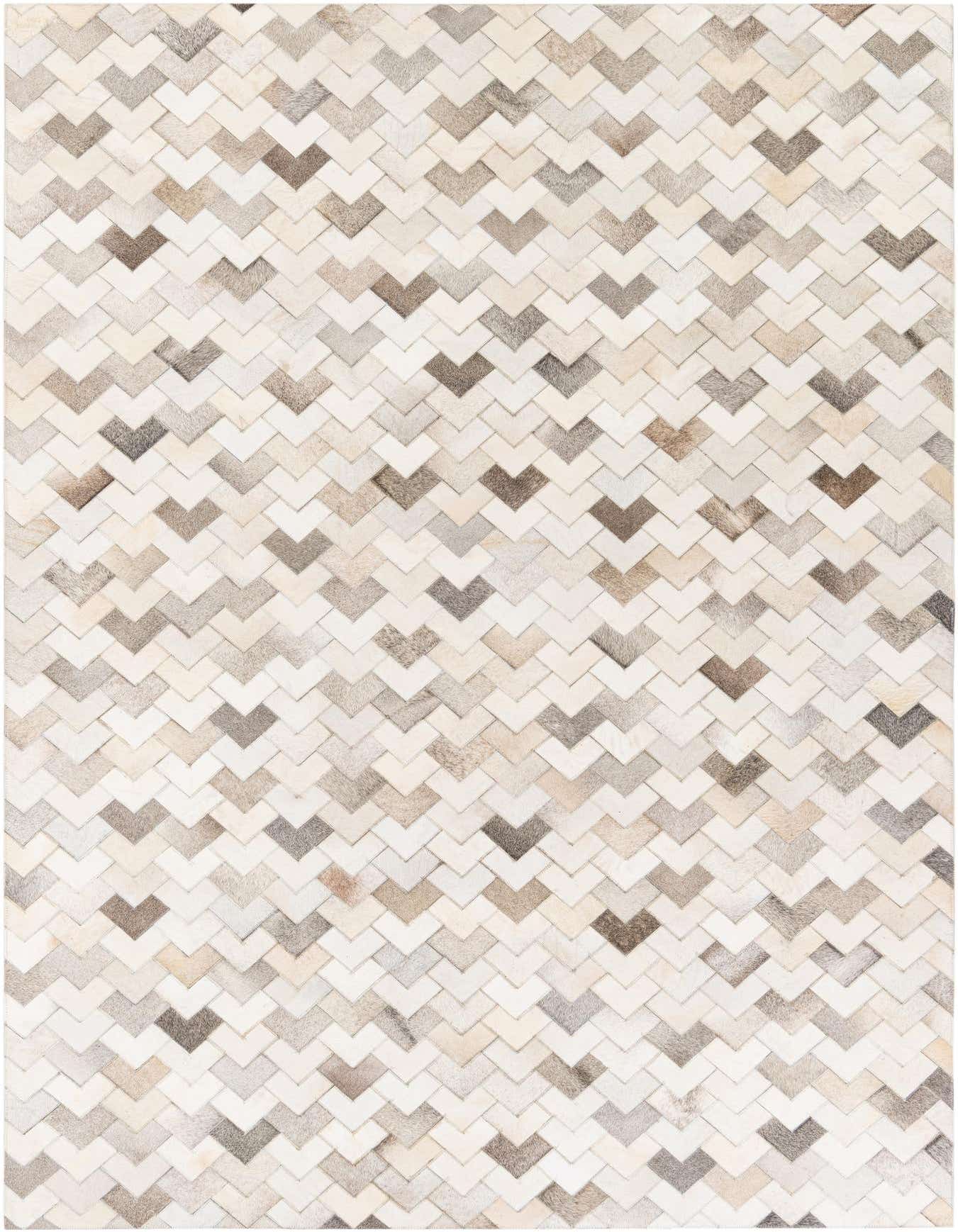 A 6x9 rectangular Cowhide Stocks rug featuring a modern chevron pattern in various shades of multi-colored natural cowhide.