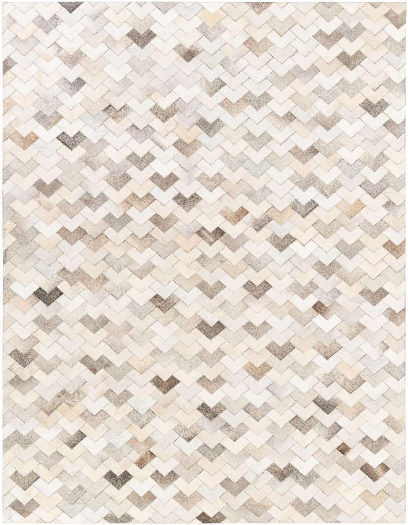 A 6x9 rectangular modern cowhide rug featuring a chevron pattern in various shades of cream, beige, and light brown.