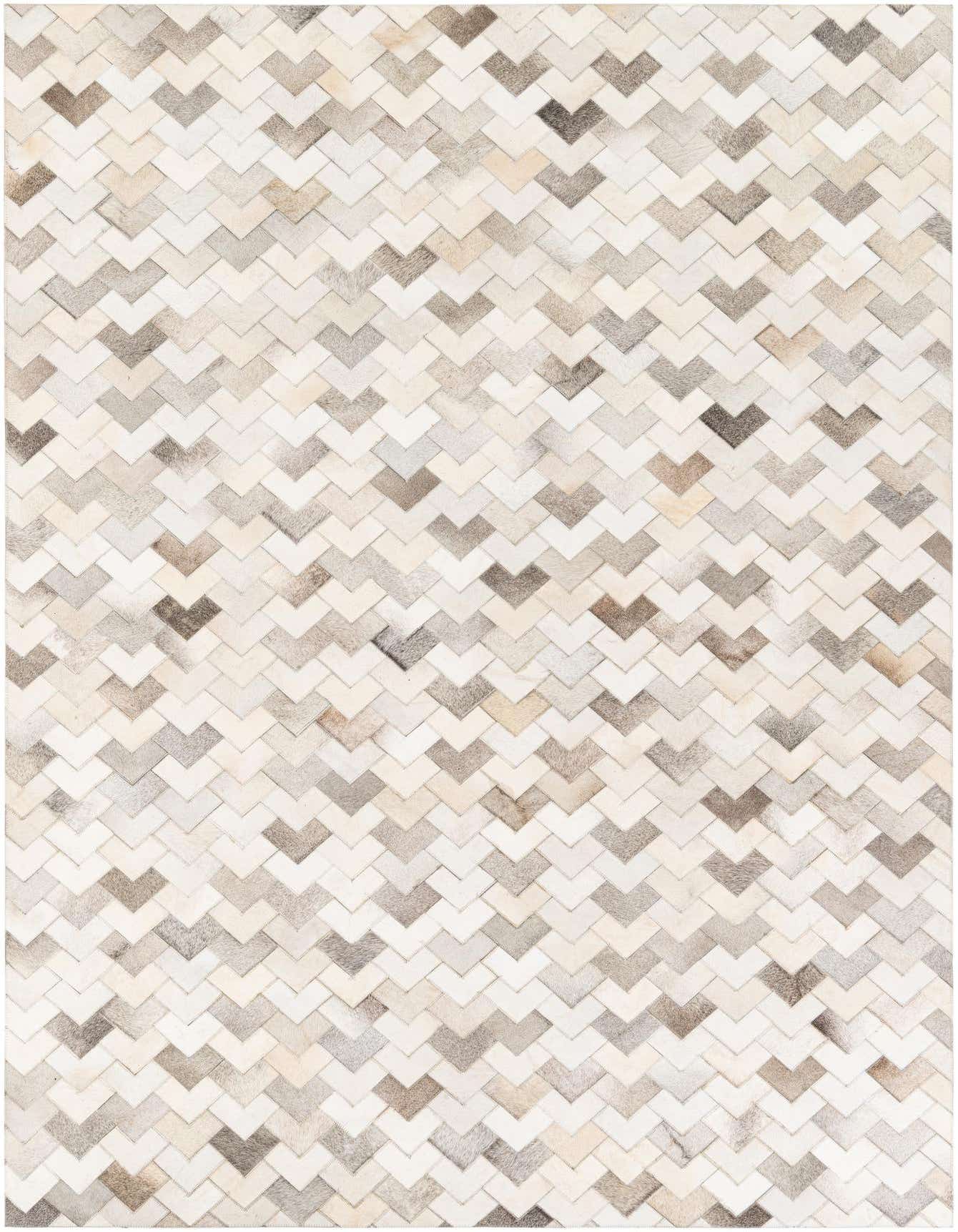 A 6x9 rectangular modern cowhide rug with a chevron pattern in various shades of cream, beige, and light brown.