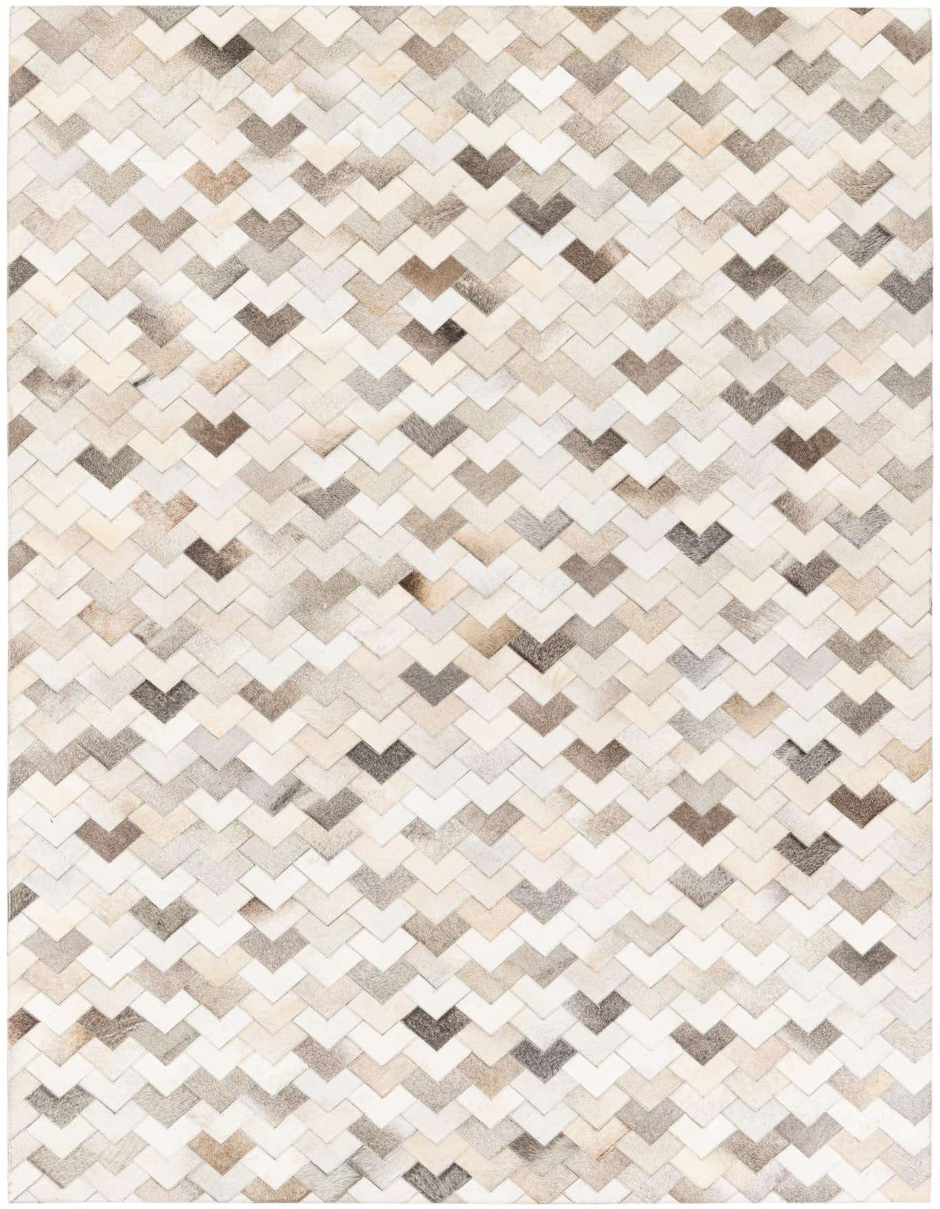 A 6x9 rectangular Cowhide Stocks rug featuring a modern chevron pattern in multi-colored natural cowhide and leather.