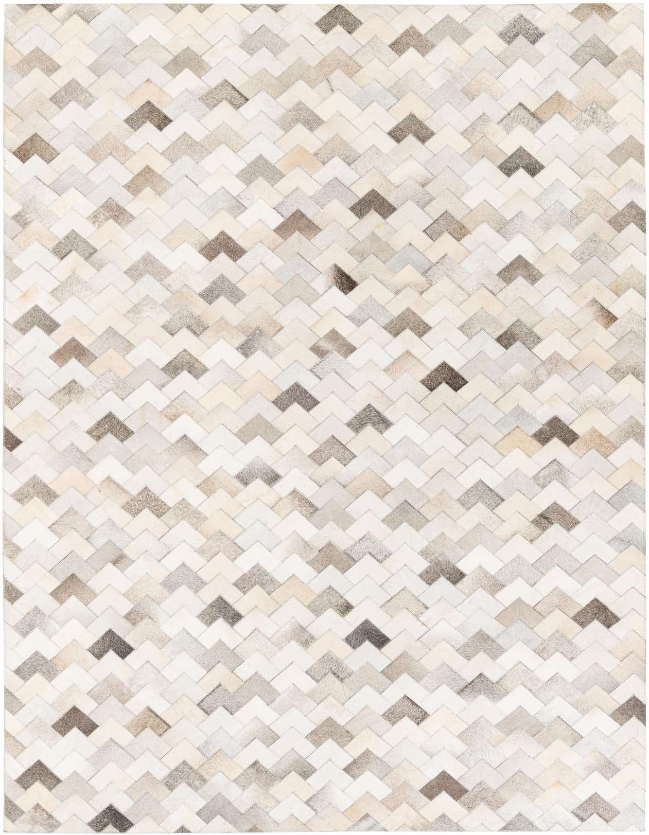 A 6x9 rectangular multi-colored cowhide rug with a modern chevron pattern in various shades of brown, beige, and white.