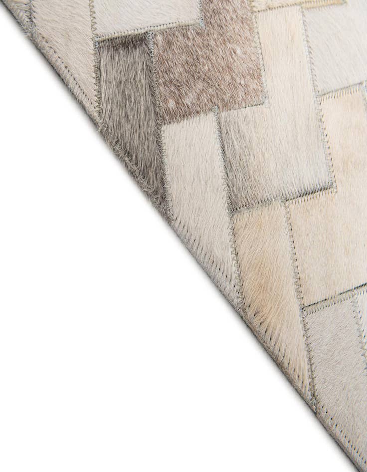 Detail image of  6' 1 x 9' Cowhide Stocks Rug